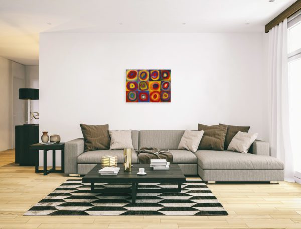 Photo of Color Study Squares with Concentric Circles Print in modern minimalistic living room.